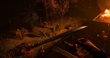 Survivor swings a blade into a crowd of zombies as a forest burns at night.