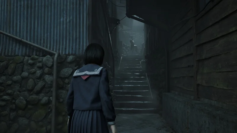 gameplay screenshot in a dark narrow alley at night, character walking toward the shadows